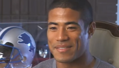 Johnnie Morton with Detroit Lion football helmet in the background